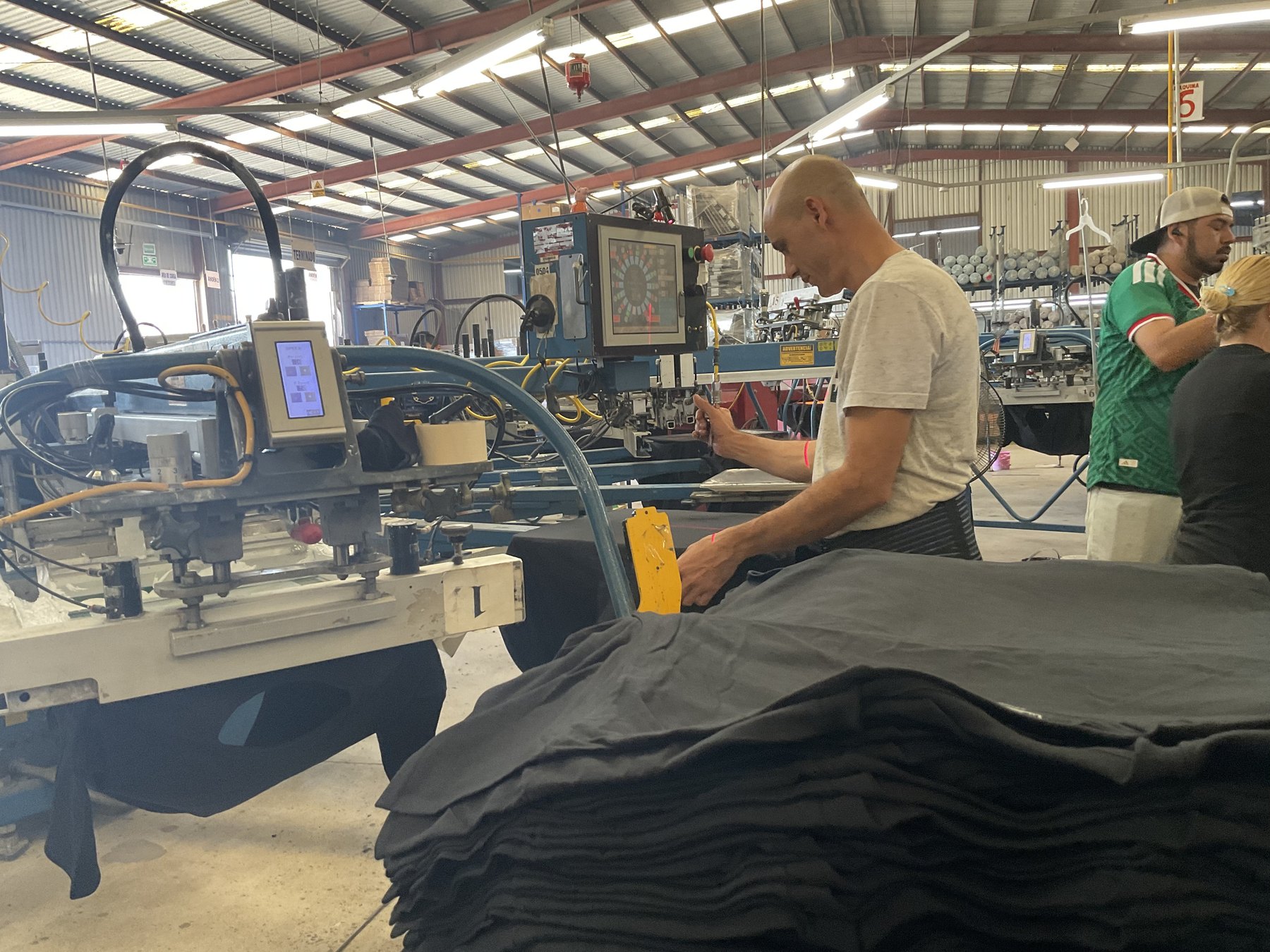 Heat press finishing a printed shirt