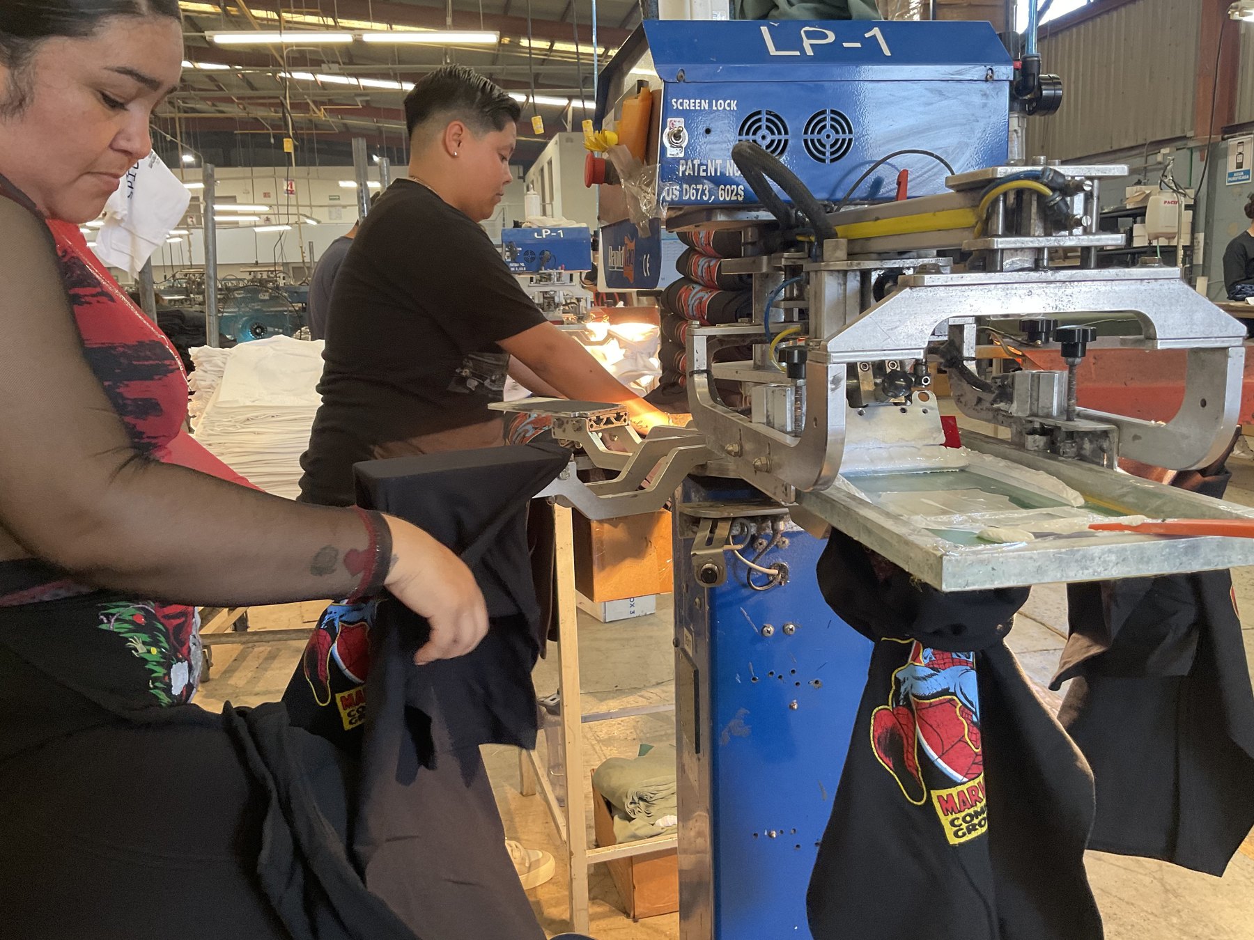 Folding a finished garment with licensed artwork